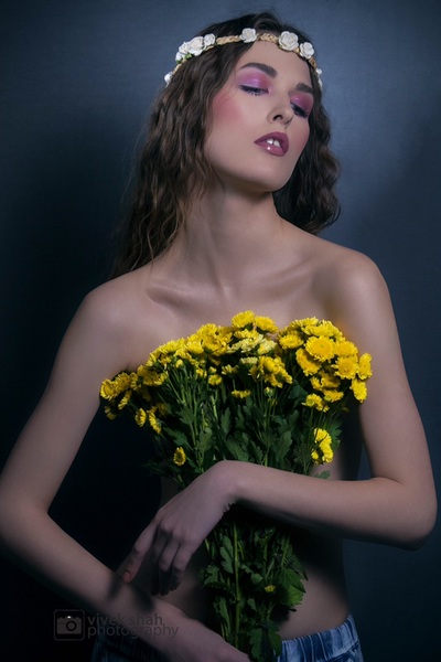 Nude model with bunch of Yellow Flower